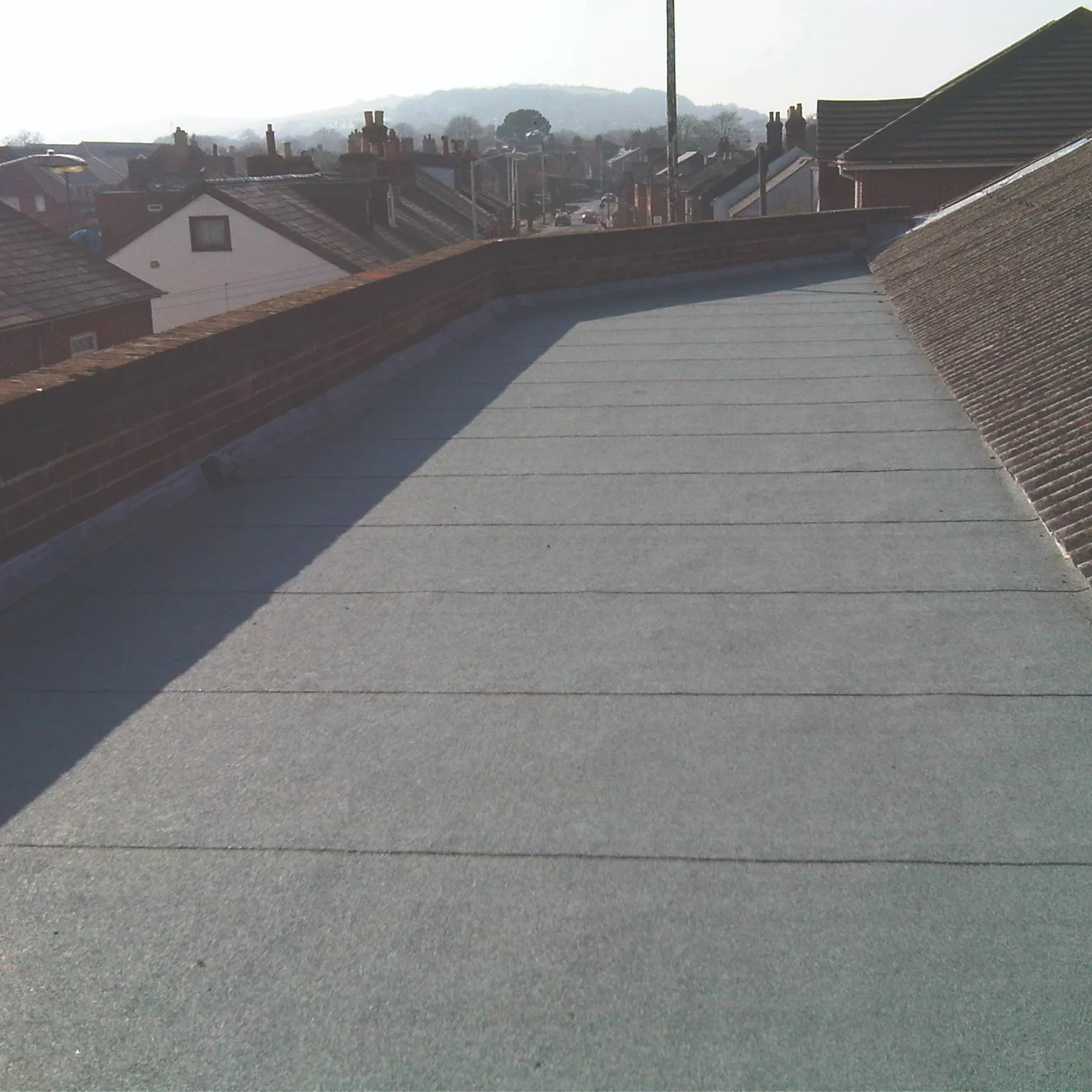 Fibreglass flat roof installation in progress