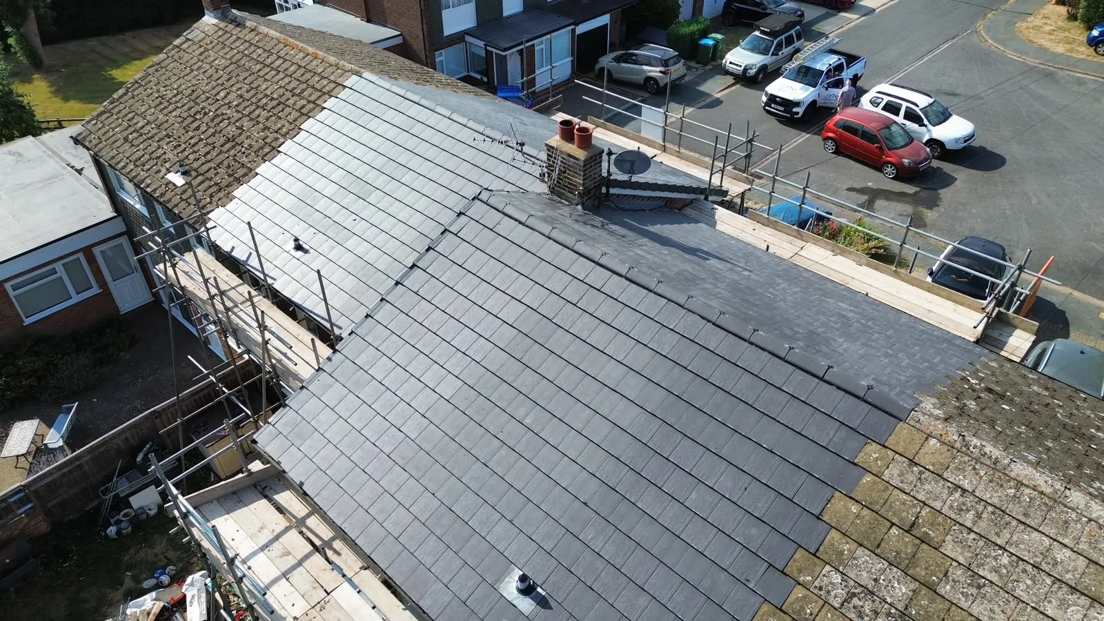 Drone view of a completed roof with the Stanley & Son van on site