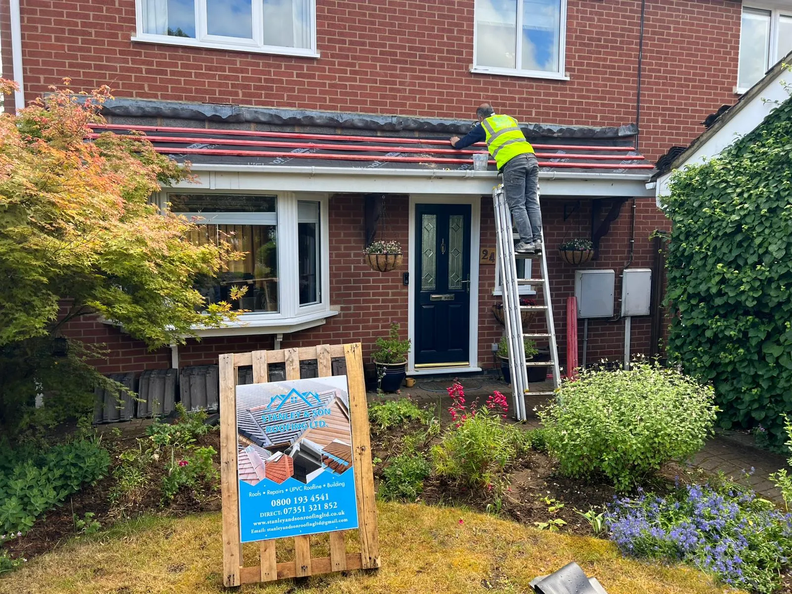 Stanley & Son job board outside a customer's home